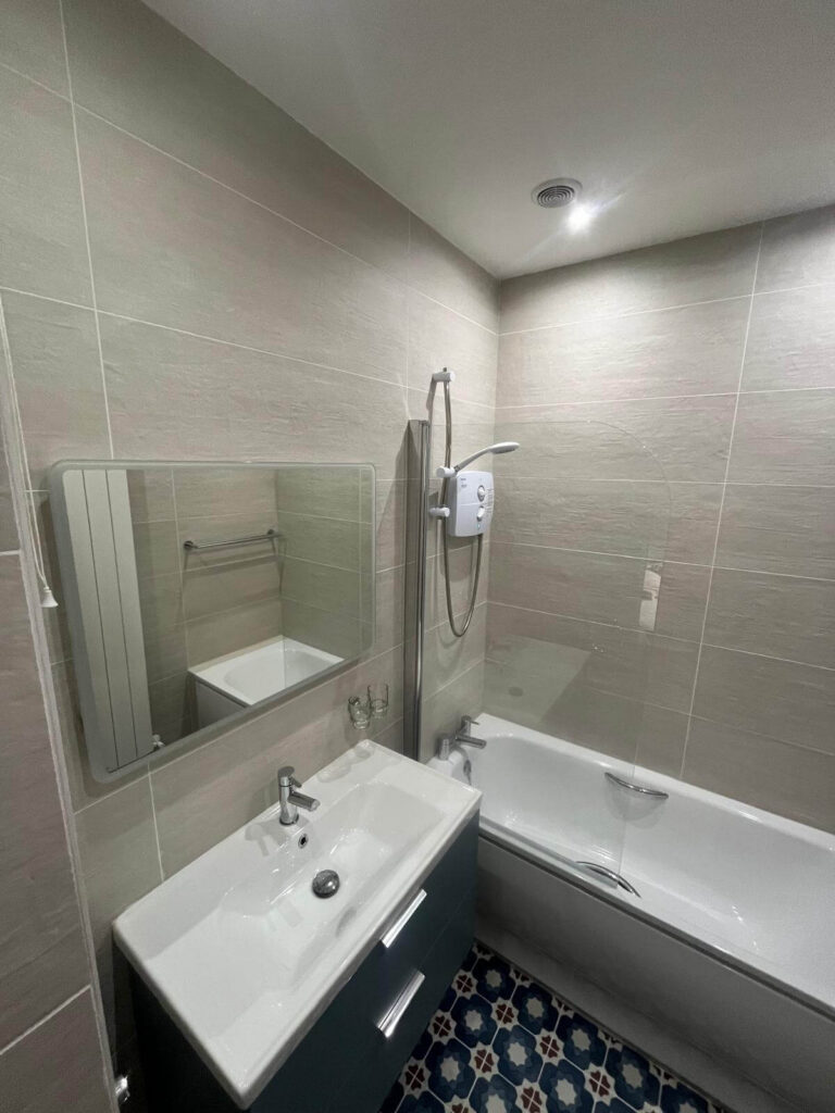 new tiled walls and bath